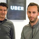 Then-Uber CEO Travis Kalanick, left, and Anthony Levandowski, co-founder of Otto, pose for a photo in the lobby of Uber headquarters, in San Francisco. Photo: AP